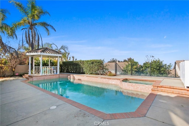 view of swimming pool with a gazebo, a patio, and an in ground hot tub