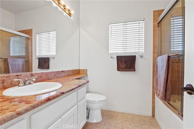 full bathroom with toilet, vanity, tile patterned floors, and shower / bath combination with glass door