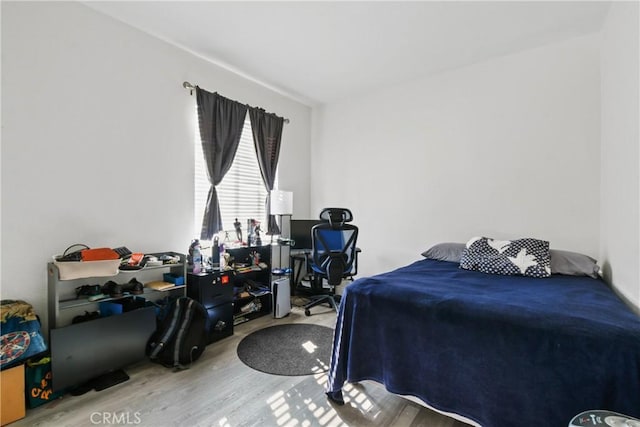 bedroom with hardwood / wood-style flooring