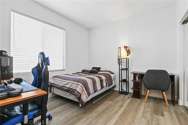 bedroom with hardwood / wood-style floors