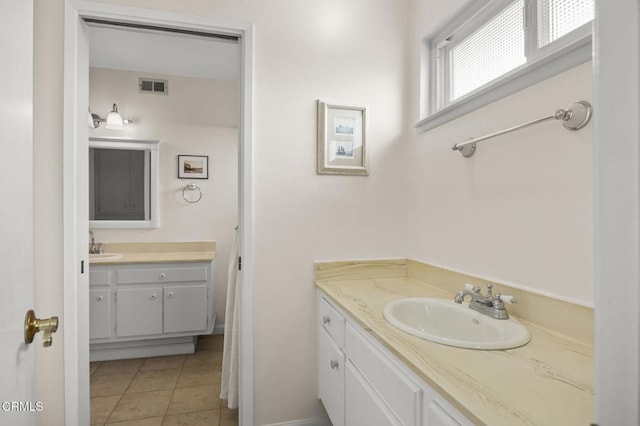 bathroom featuring tile patterned floors and vanity