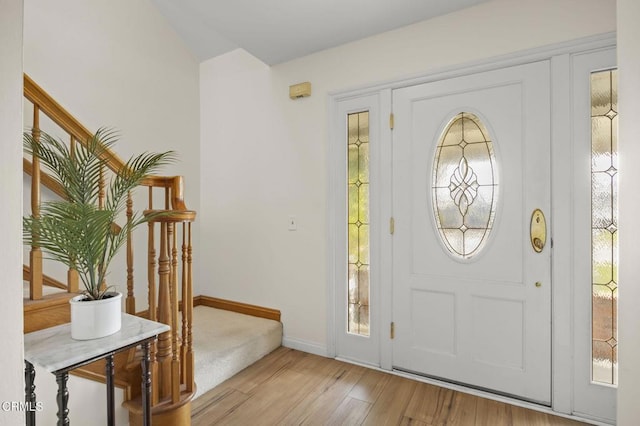 foyer featuring light hardwood / wood-style floors and a wealth of natural light