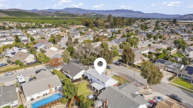 birds eye view of property with a mountain view