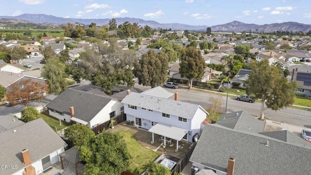 birds eye view of property with a mountain view