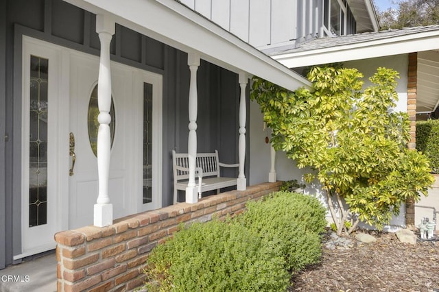 property entrance featuring covered porch