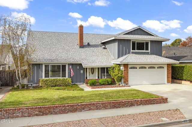 front facade featuring a front lawn and a garage