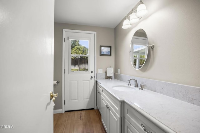 bathroom featuring vanity and hardwood / wood-style floors