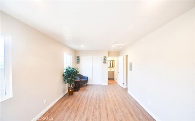 corridor featuring light hardwood / wood-style floors