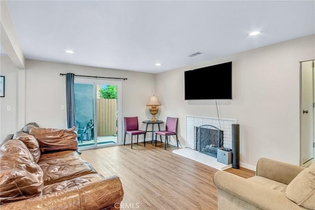 9022 Marlene Ave, Garden Grove, CA 92841 - living room featuring light wood finished floors, a fireplace, recessed lighting, and baseboards