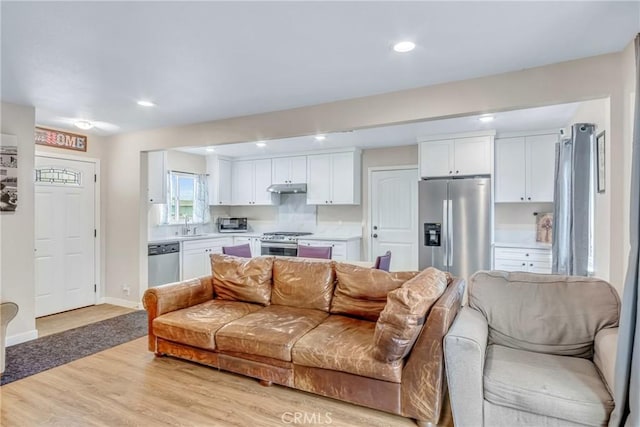 9022 Marlene Ave, Garden Grove, CA 92841 - living area featuring light wood-style floors, recessed lighting, and baseboards