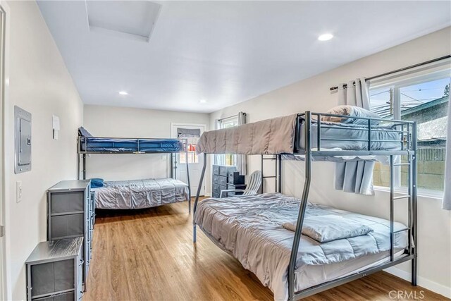 9022 Marlene Ave, Garden Grove, CA 92841 - bedroom featuring attic access, wood finished floors, electric panel, baseboards, and recessed lighting