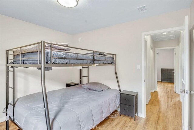 9022 Marlene Ave, Garden Grove, CA 92841 - bedroom with wood finished floors, attic access, and baseboards