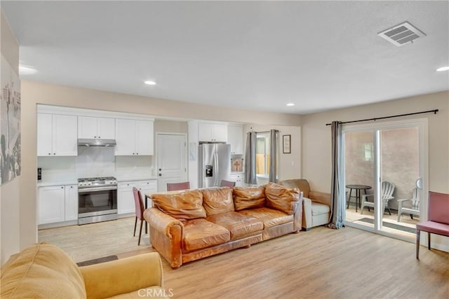 9022 Marlene Ave, Garden Grove, CA 92841 - living room with light wood-type flooring and recessed lighting