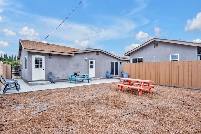 9022 Marlene Ave, Garden Grove, CA 92841 - rear view of house with fence, stucco siding, and a patio area