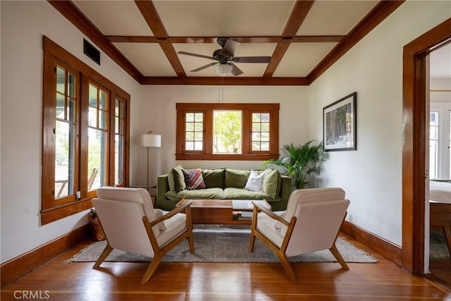 living room with beam ceiling, light hardwood / wood-style flooring, and coffered ceiling