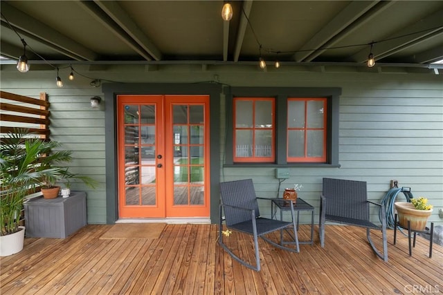 wooden deck featuring french doors