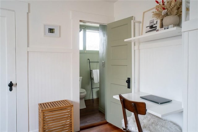 bathroom featuring hardwood / wood-style flooring and toilet