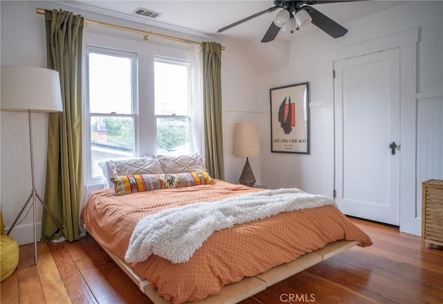 bedroom with ceiling fan and wood-type flooring