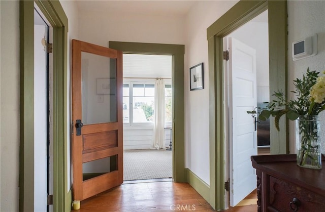 hall with light hardwood / wood-style flooring