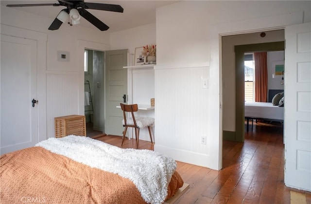 bedroom with ceiling fan and hardwood / wood-style floors