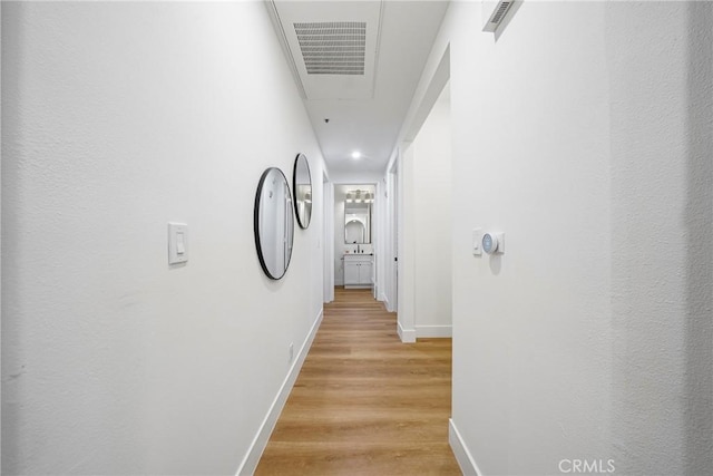 corridor featuring light hardwood / wood-style flooring