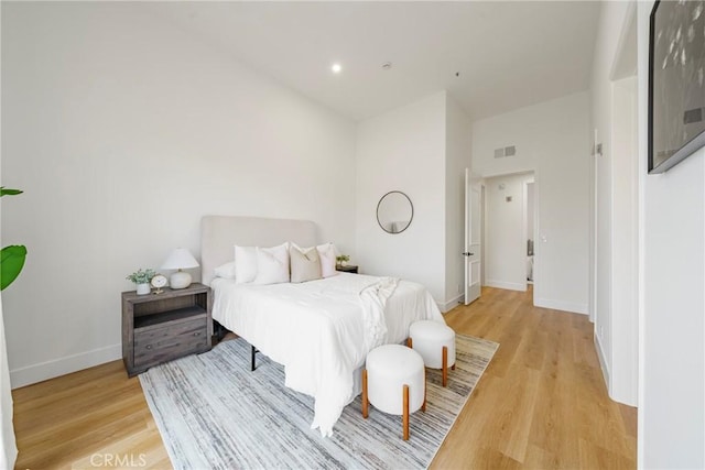 bedroom with light hardwood / wood-style flooring