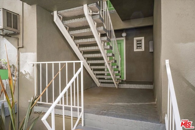 stairs with hardwood / wood-style flooring