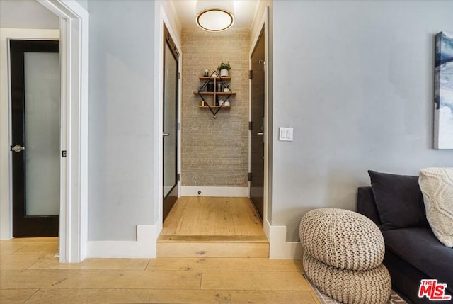 corridor featuring light hardwood / wood-style flooring