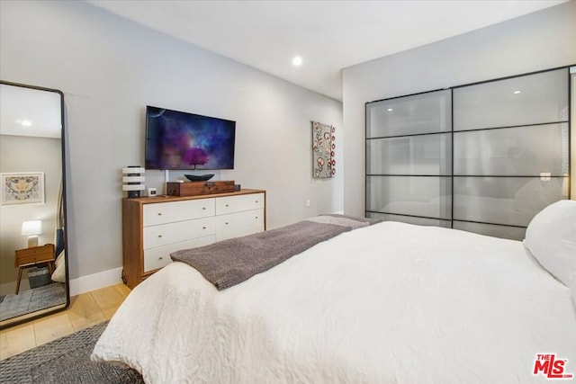 bedroom with light wood-type flooring