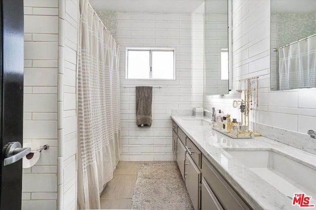 bathroom featuring tile patterned floors and vanity