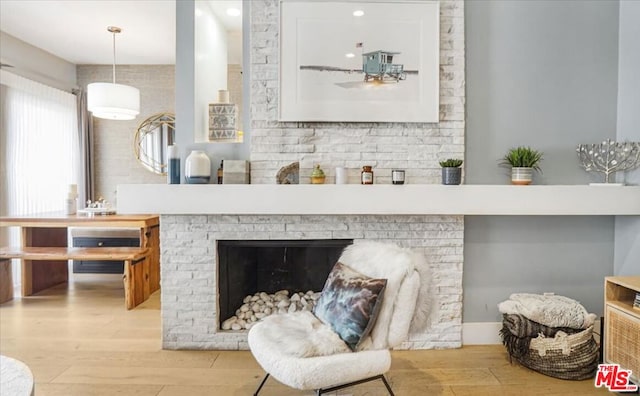 living room with a fireplace and light hardwood / wood-style flooring