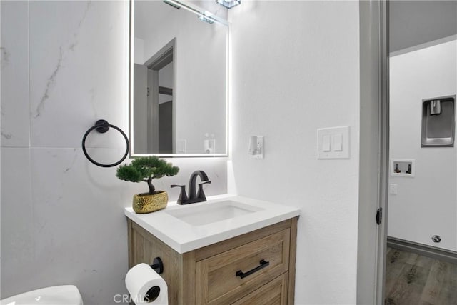 bathroom with wood-type flooring and vanity