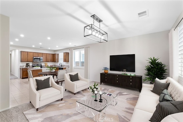 tiled living room featuring sink