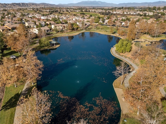 drone / aerial view with a water and mountain view