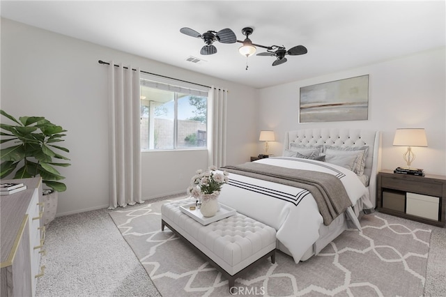 bedroom featuring ceiling fan and light colored carpet