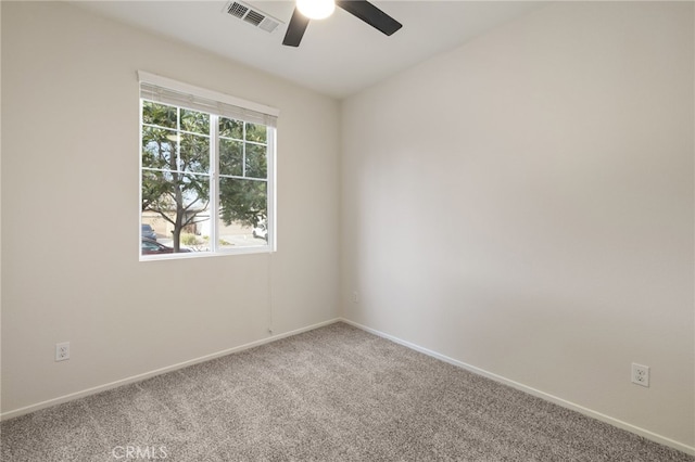 spare room with ceiling fan and carpet floors