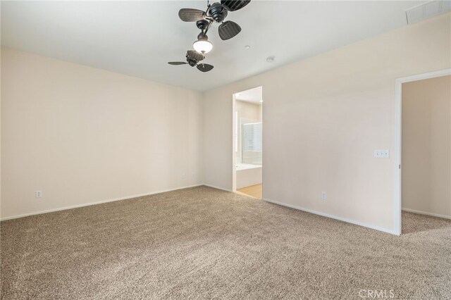 empty room with ceiling fan and light colored carpet