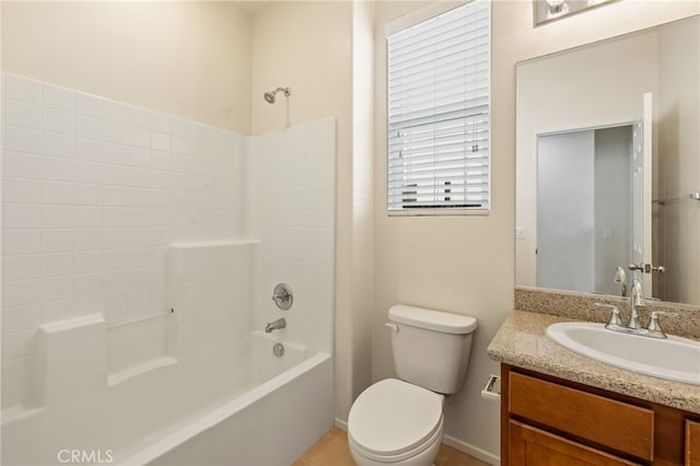 full bathroom featuring toilet, vanity, and  shower combination