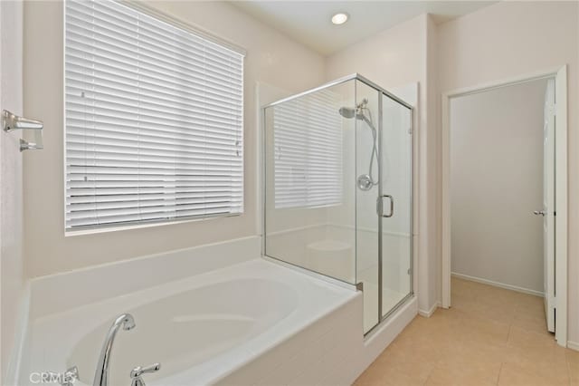 bathroom featuring separate shower and tub and tile patterned flooring