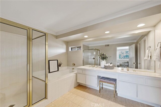 bathroom with ornamental molding, vanity, independent shower and bath, and tile patterned floors