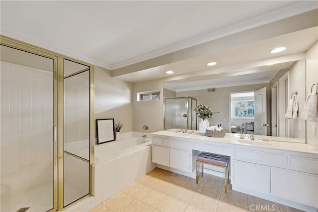 28 Pebble Beach Dr, Rancho Mirage, CA 92270 - full bath with crown molding, double vanity, a garden tub, a stall shower, and tile patterned flooring