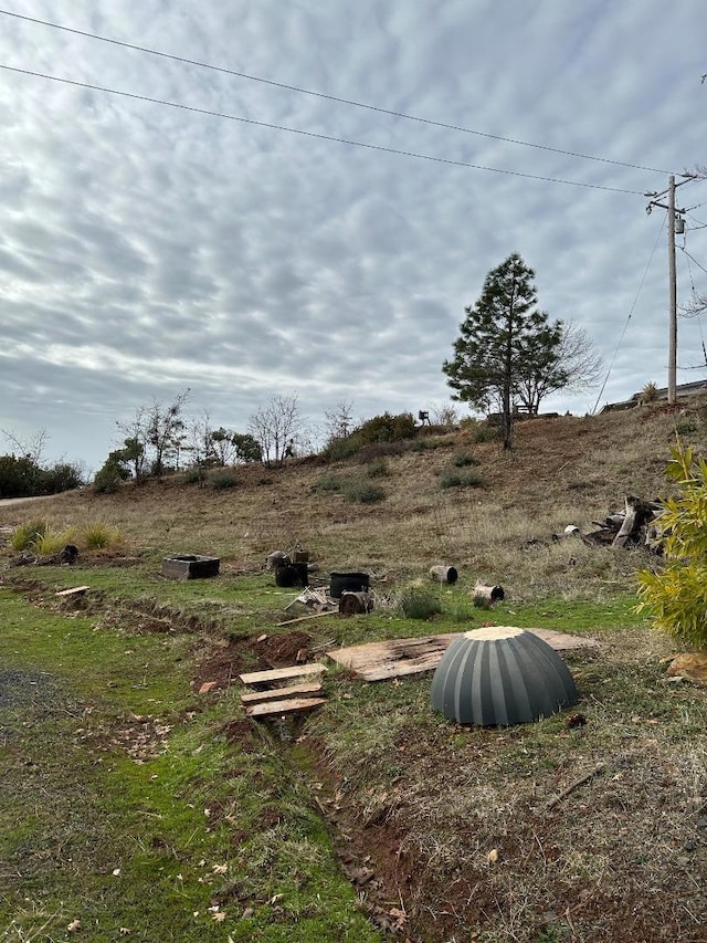 view of yard with a rural view