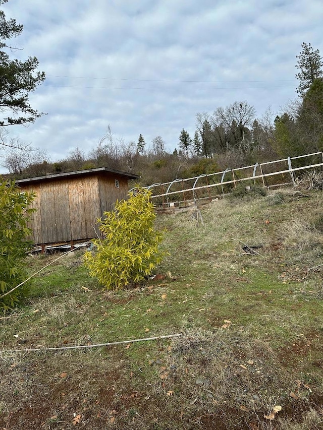 view of yard with a rural view