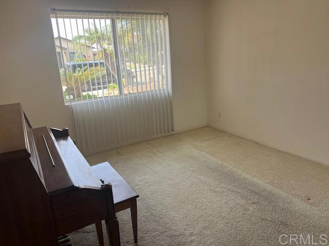 sitting room featuring carpet floors