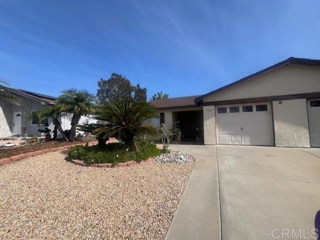 ranch-style home featuring a garage