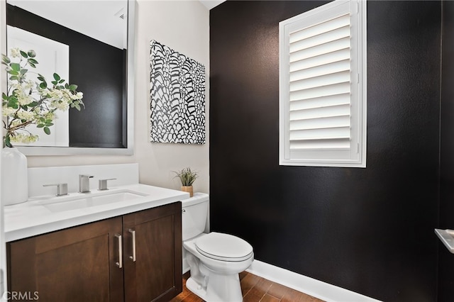 bathroom featuring toilet and vanity