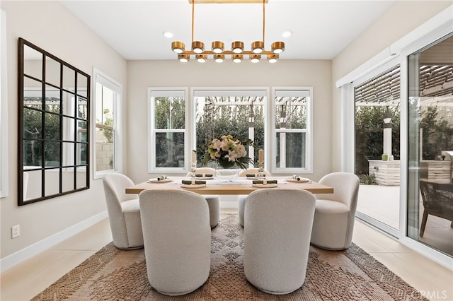 sunroom with a notable chandelier