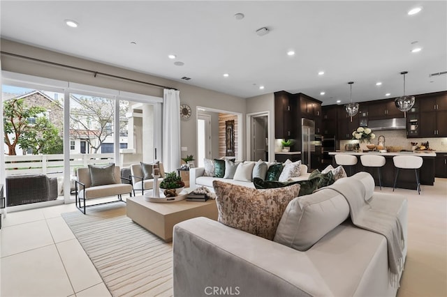 tiled living room featuring sink