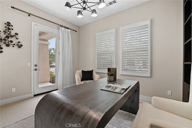 dining area with an inviting chandelier