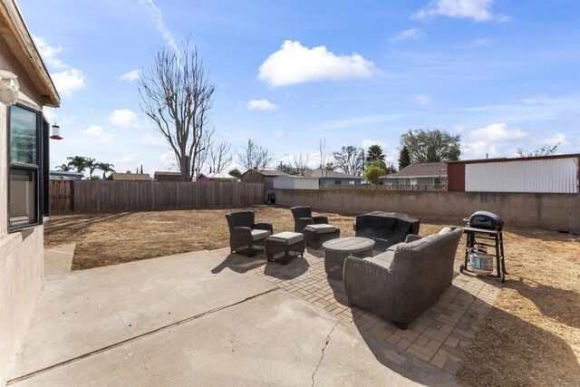 view of patio / terrace featuring an outdoor living space and grilling area